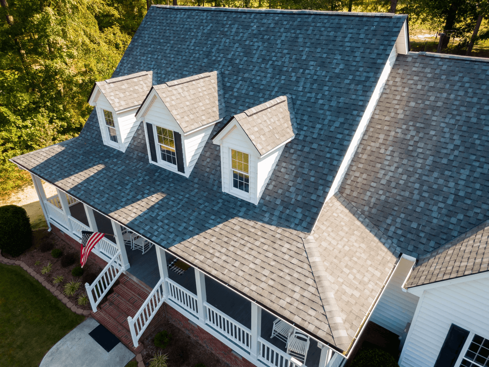 Aerial view of a finished Rescue Roofing asphalt shingle roof on a Houston home